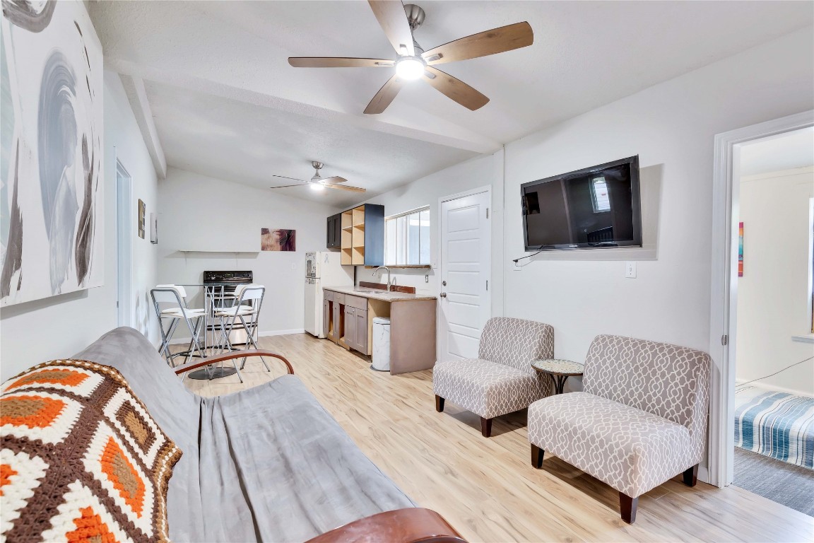 2103 Chaparral Park Road, Unit D Manchaca, TX 78652 - Photo 1 of 1 a living room with furniture and a flat screen tv