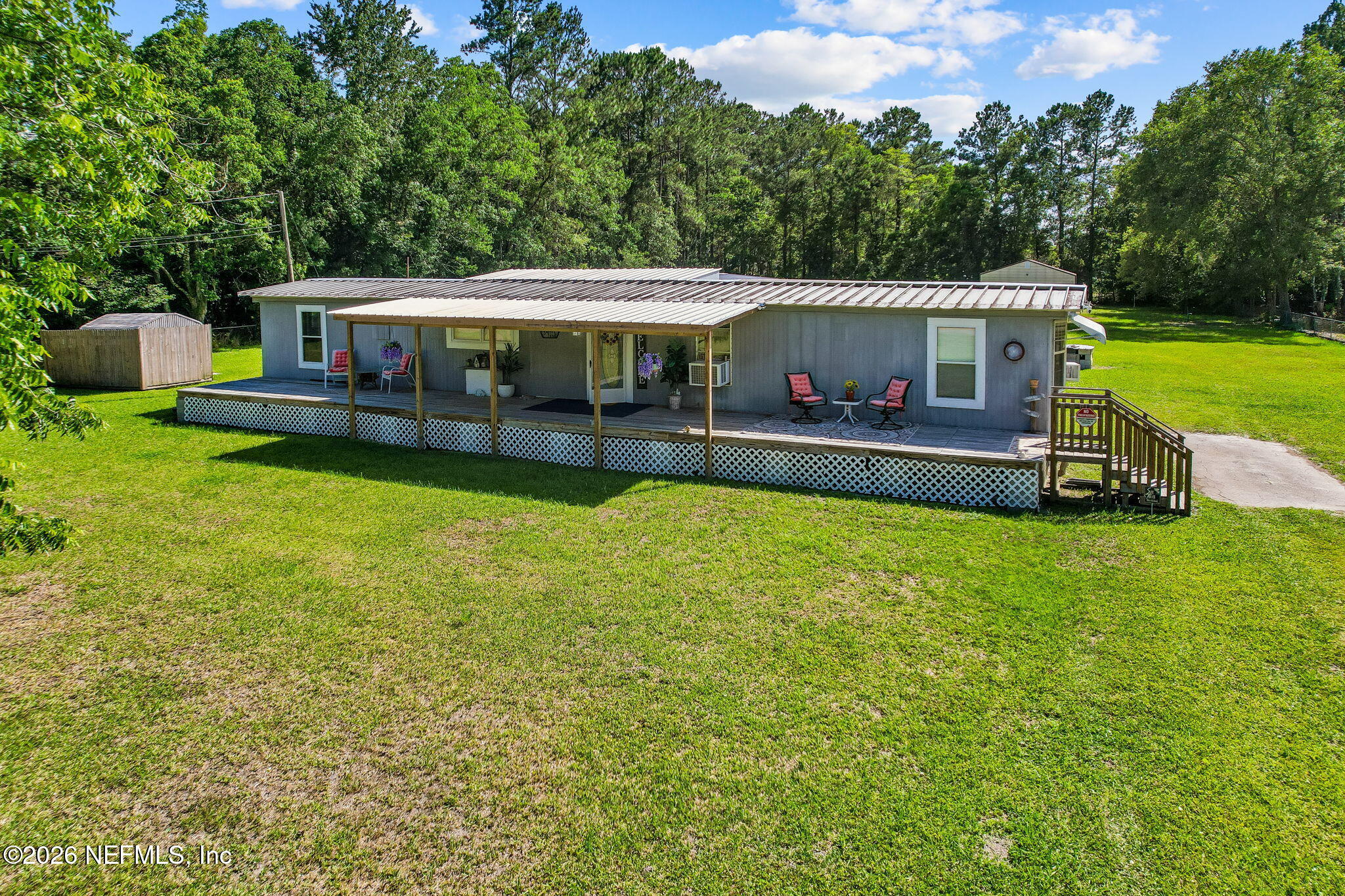 15690 Sears Road Jacksonville, FL 32218 - Photo 5 of 27 a view of a house with a yard
