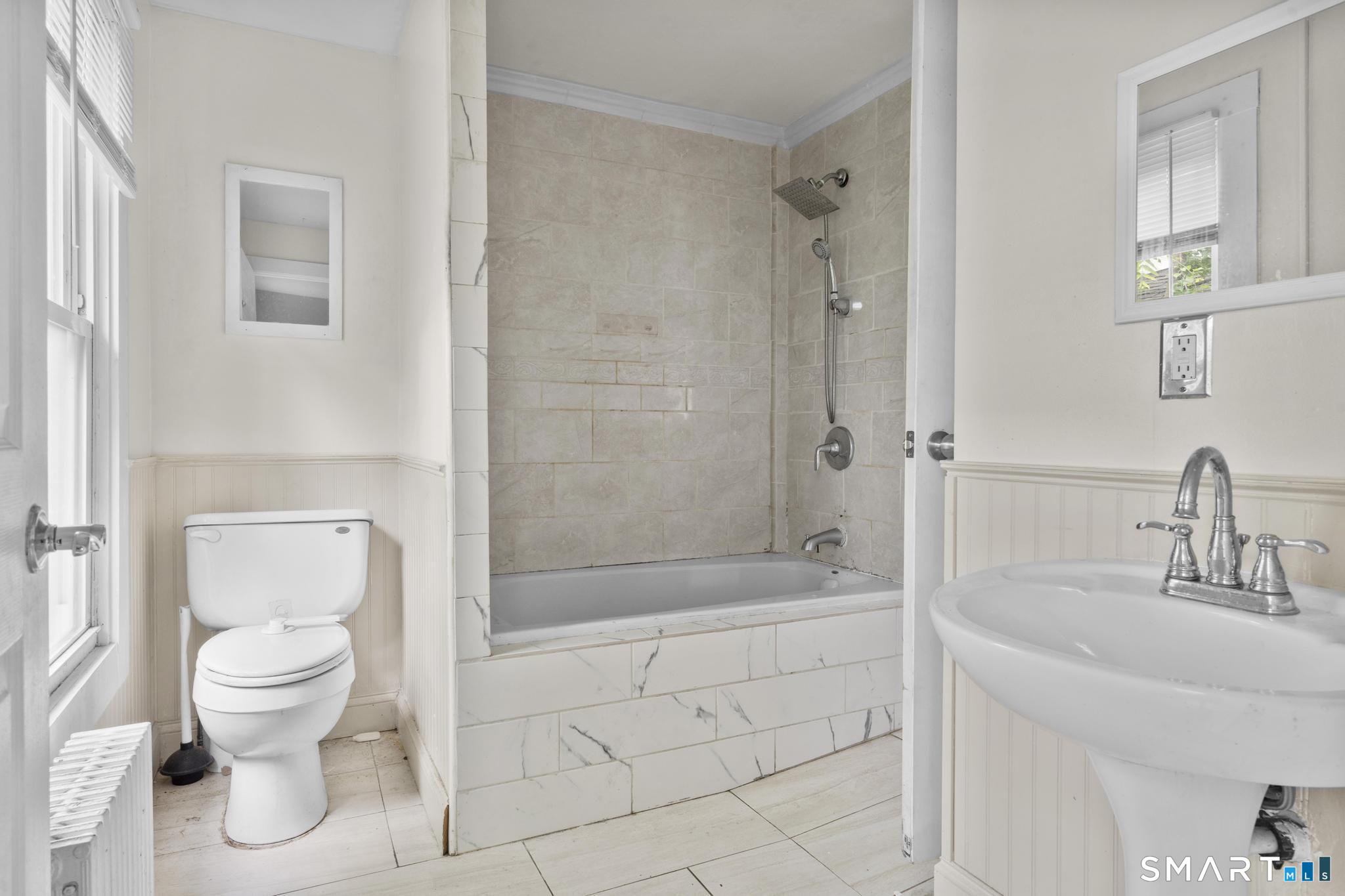 101 Meridian Street Meriden, CT 06451 - Photo 20 of 26 a bathroom with a toilet sink and shower