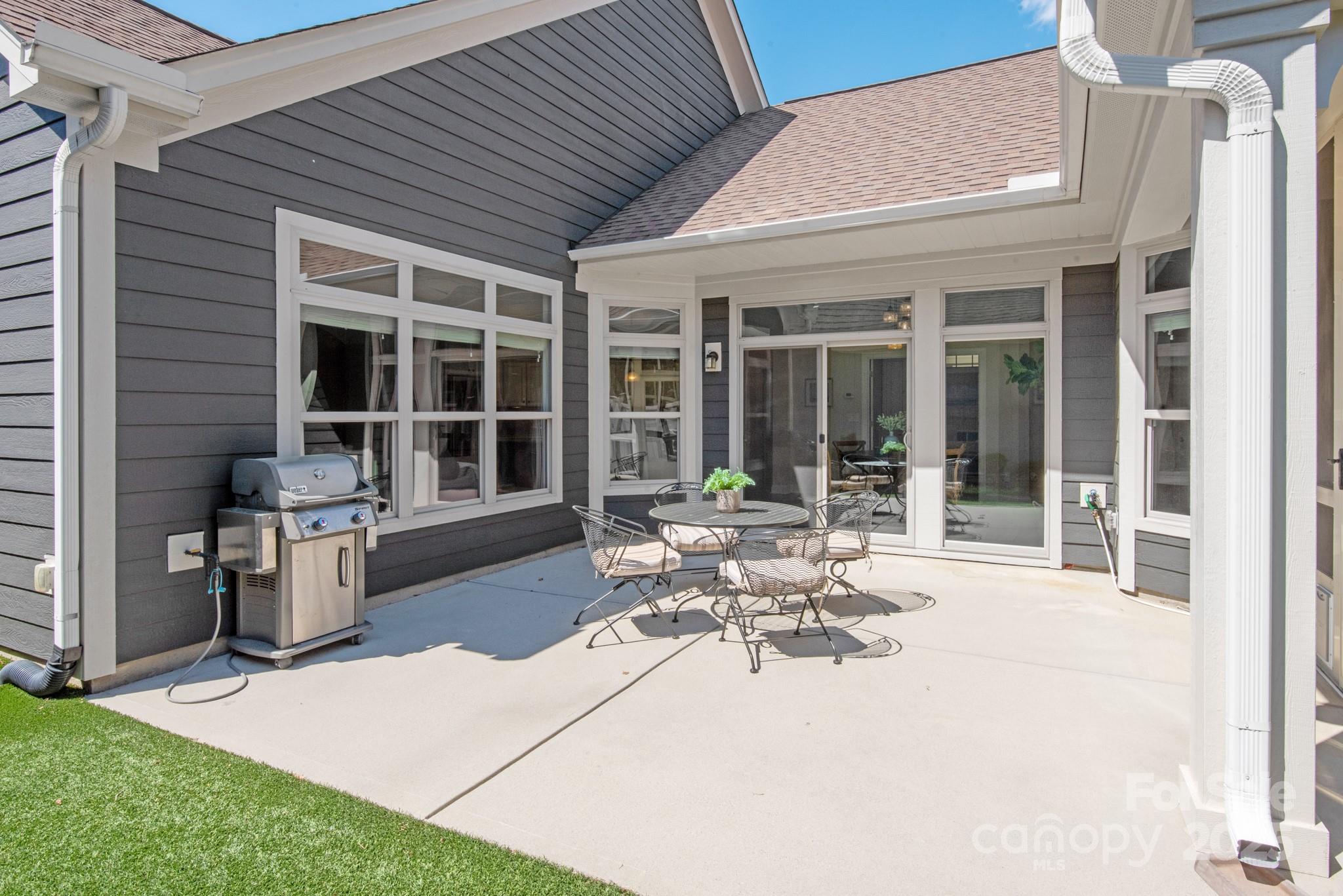 1128 Avalon Place Matthews, NC 28104 - Photo 16 of 39 a house view with a sitting space and glass windows