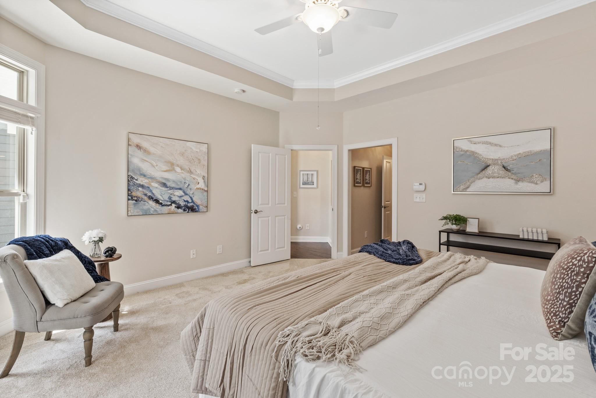 1128 Avalon Place Matthews, NC 28104 - Photo 21 of 39 a bedroom with a bed and a chandelier