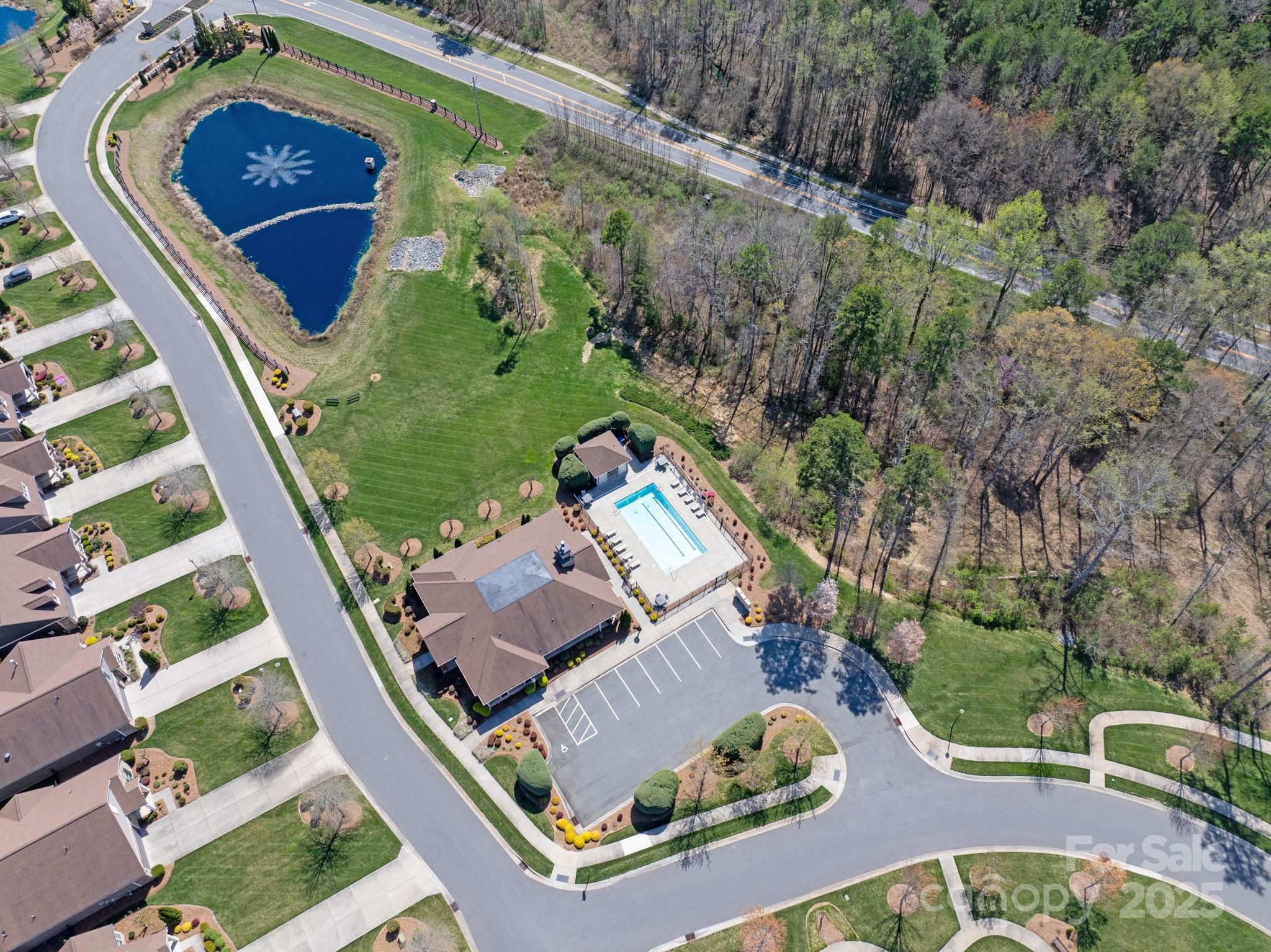 1128 Avalon Place Matthews, NC 28104 - Photo 38 of 39 an aerial view of a house with garden space and swimming pool