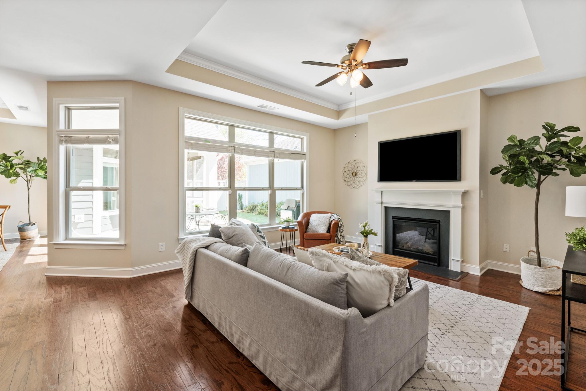 1128 Avalon Place Matthews, NC 28104 - Photo 6 of 39 a living room with furniture fireplace and a large window