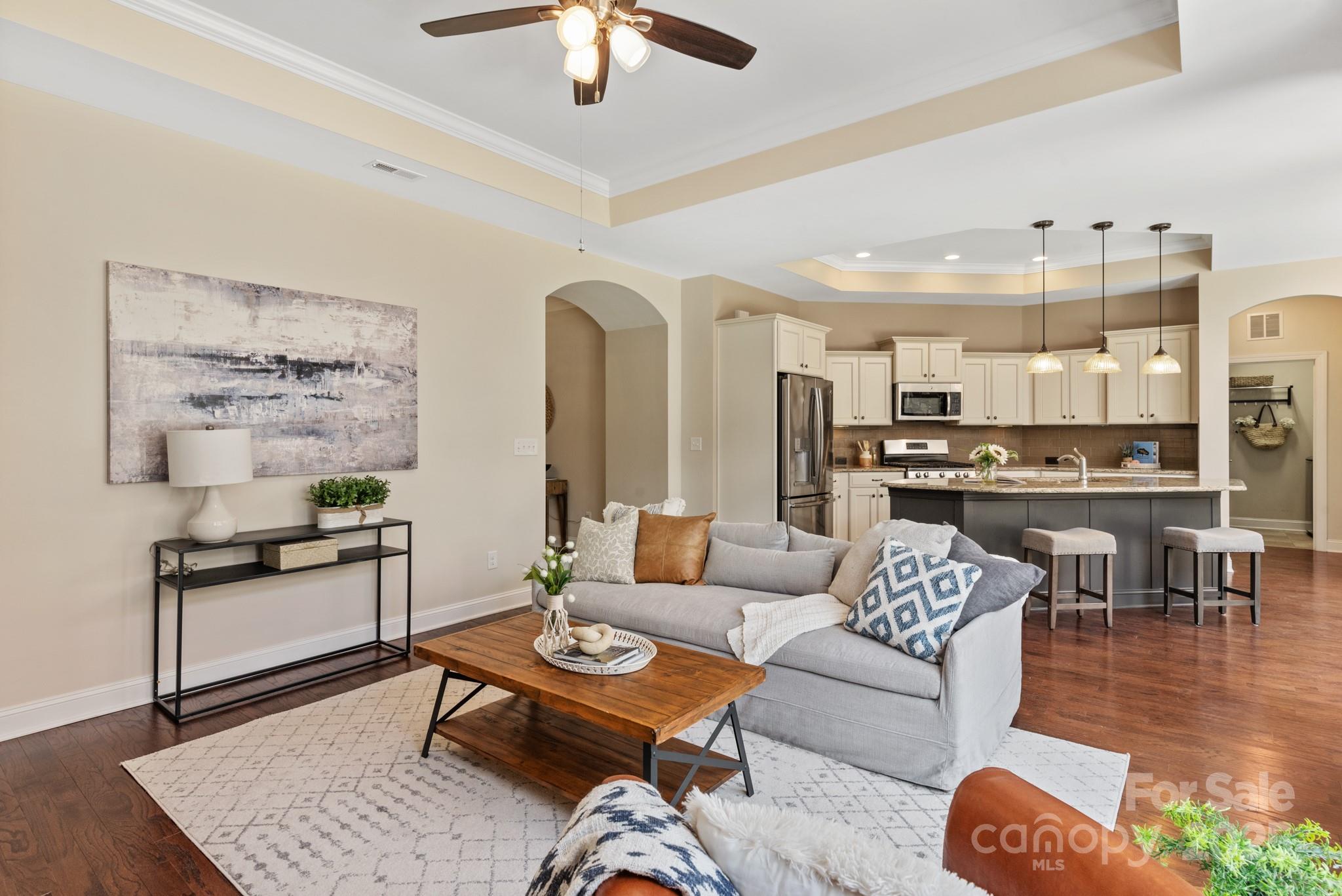 1128 Avalon Place Matthews, NC 28104 - Photo 7 of 39 a living room with furniture kitchen view and a table