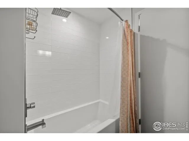 a bathroom with a shower and a tub