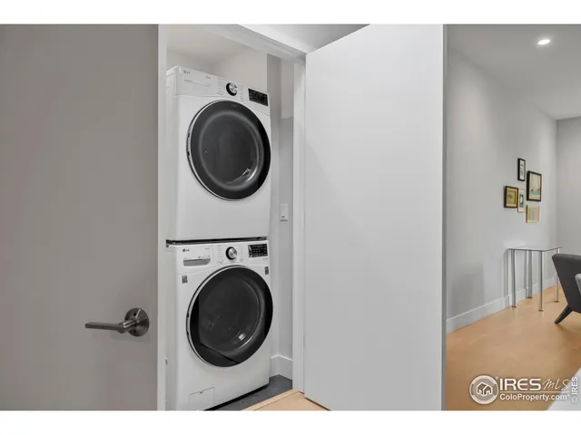 a view of a hallway with washer and dryer