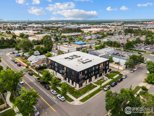an aerial view of a house with a big yard