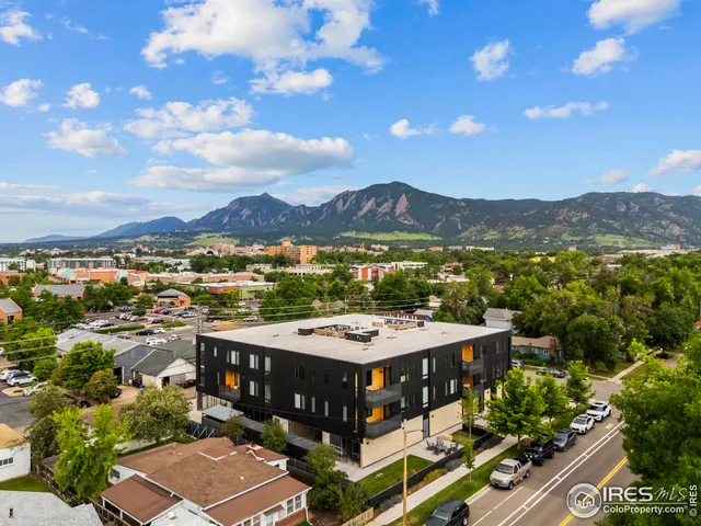 a view of a terrace with a table and chairs