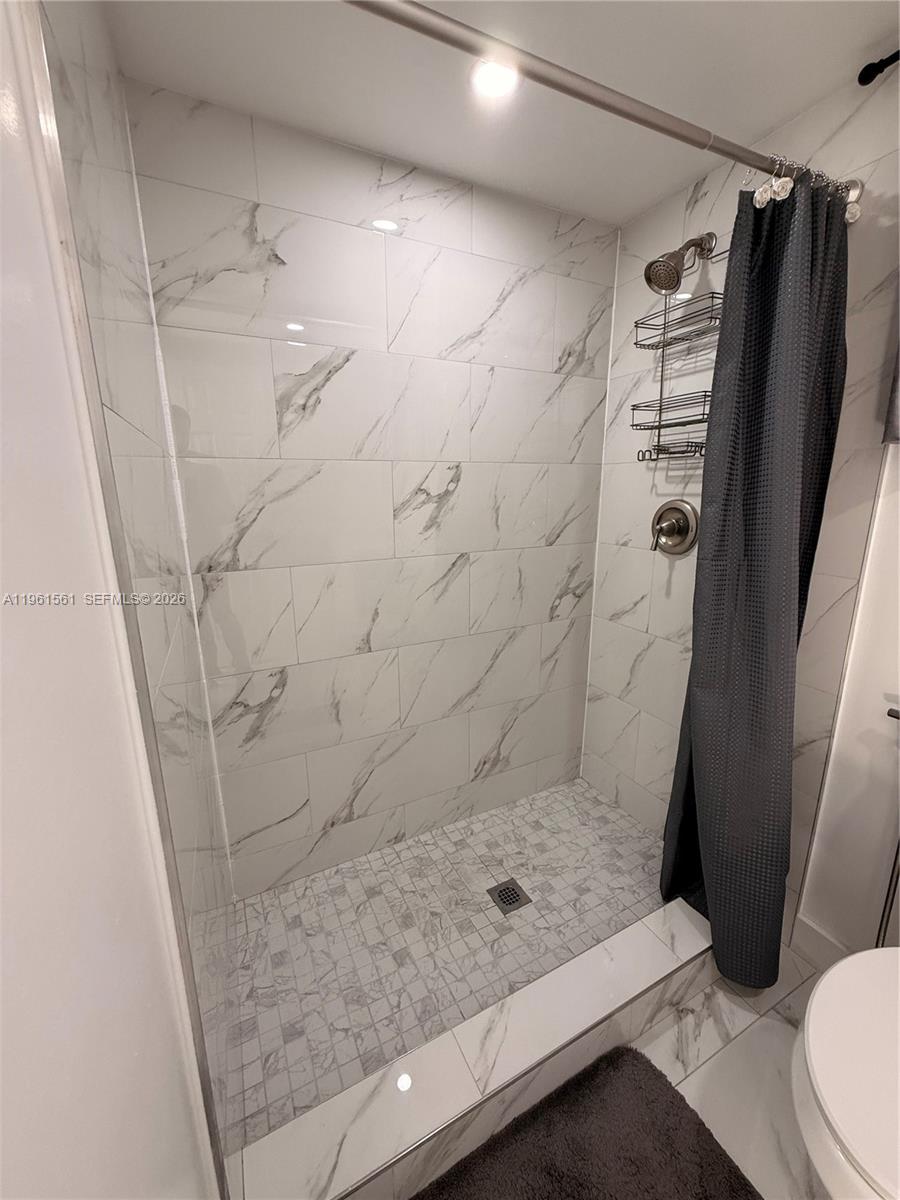 1037 Southwest 20th Avenue, Unit 2 Miami, FL 33135 - Photo 5 of 12 a bathroom with a shower and toilet
