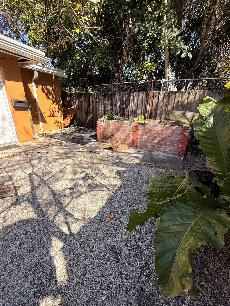 1037 Southwest 20th Avenue, Unit 2 Miami, FL 33135 - Photo 10 of 12 a view of backyard with a slide
