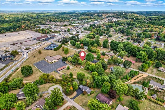 an aerial view of a house with a garden