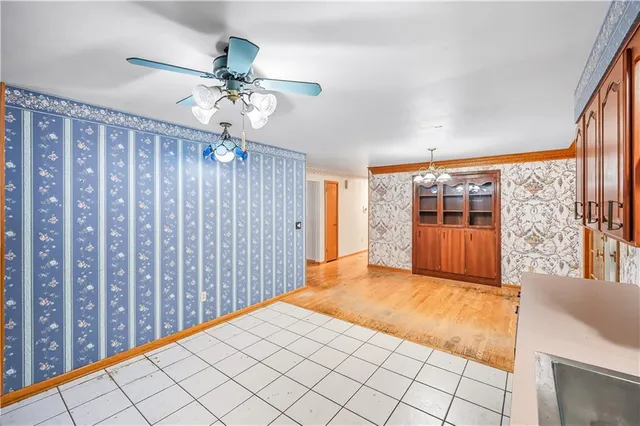 a kitchen with stainless steel appliances granite countertop a stove a sink dishwasher and a refrigerator