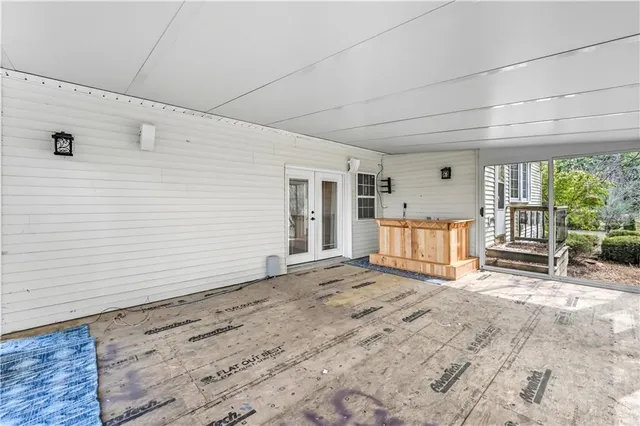 a view of a room with wooden floor and chandelier