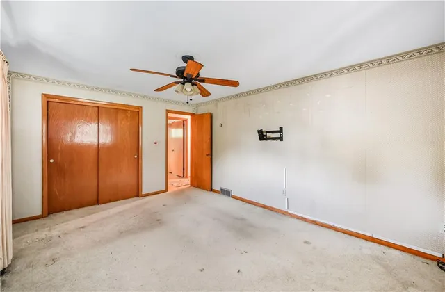 a view of a patio with a table and chairs