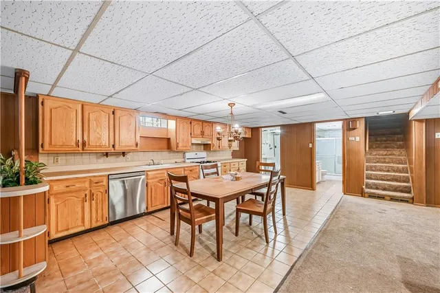 a bathroom with a tub a sink and mirror