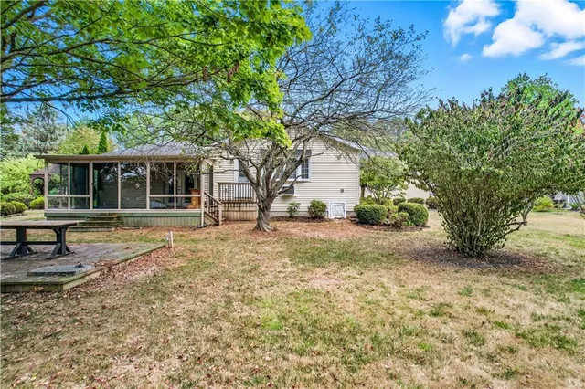 a view of a house with a yard