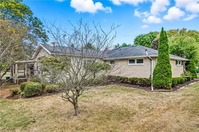 a view of a backyard with plants