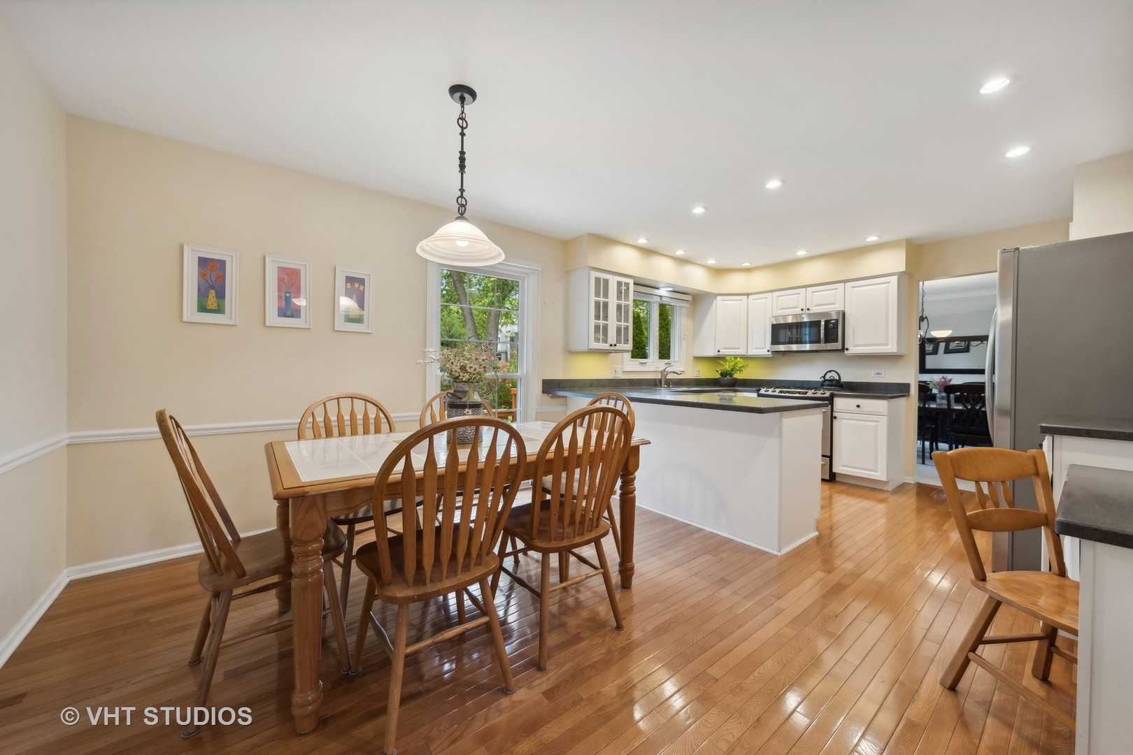 1589 Orth Drive Wheaton, IL 60189 - Photo 13 of 23 a dining room with furniture a chandelier and wooden floor