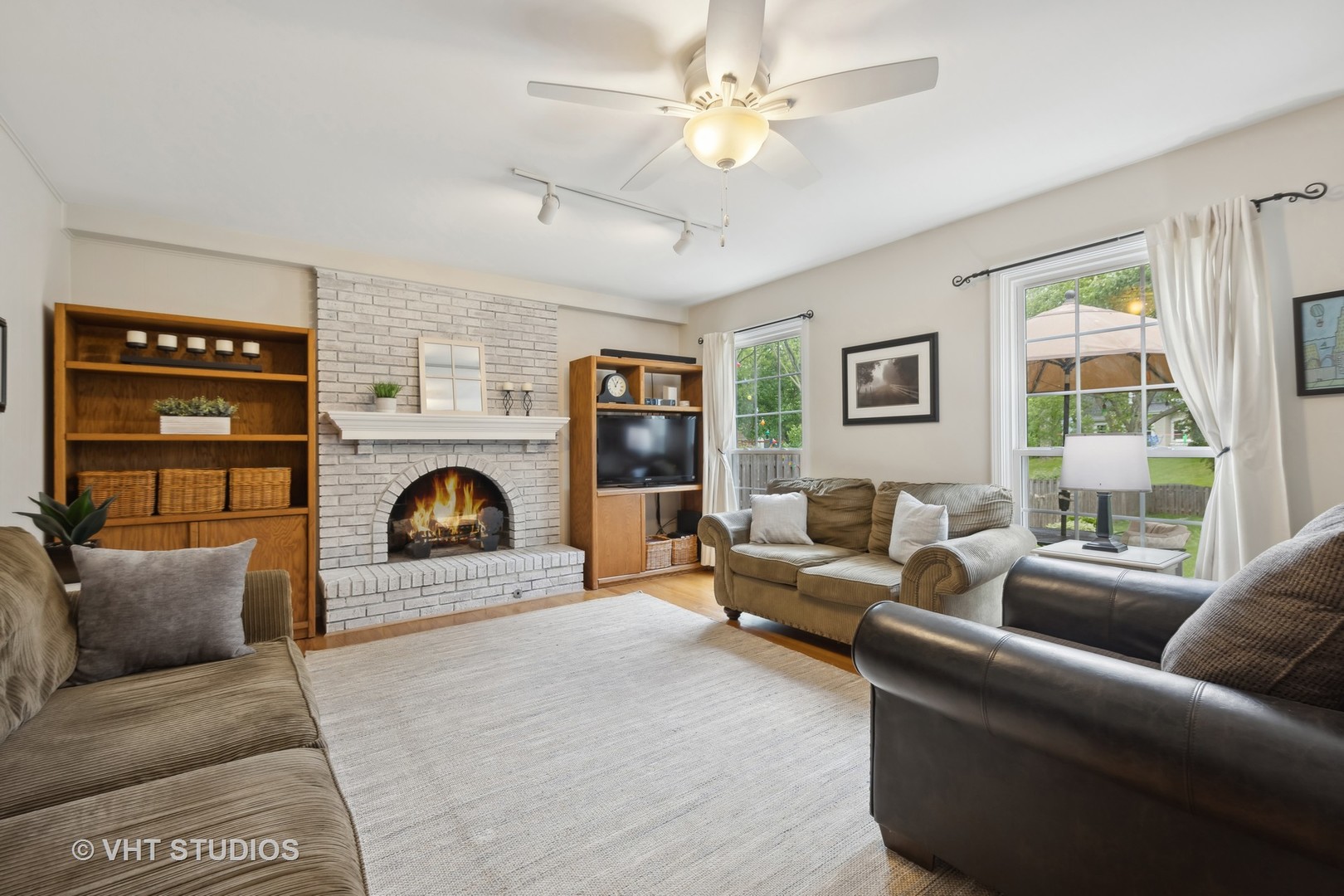 1589 Orth Drive Wheaton, IL 60189 - Photo 14 of 23 a living room with furniture and a fireplace