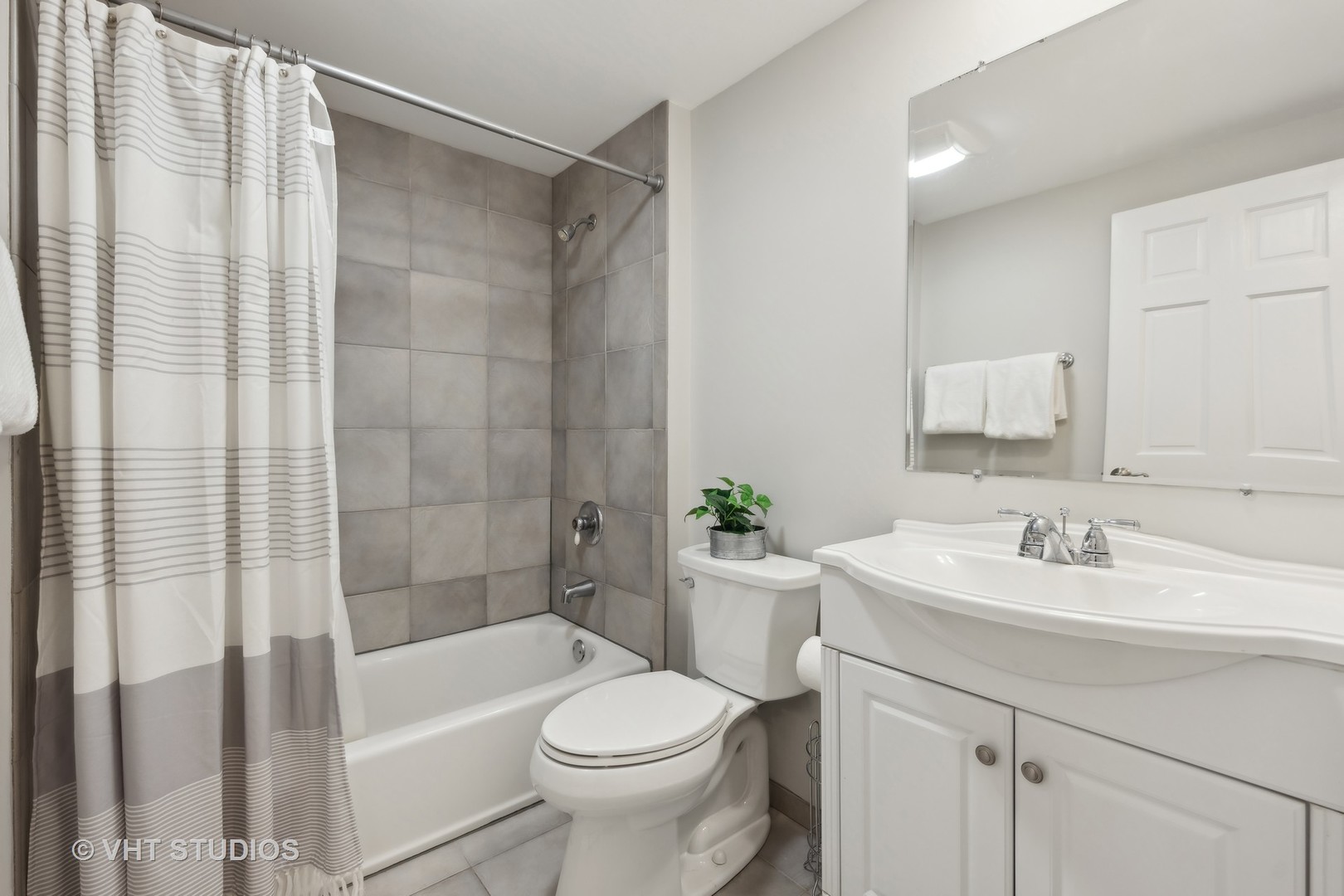 1589 Orth Drive Wheaton, IL 60189 - Photo 6 of 23 a bathroom with a sink toilet and shower