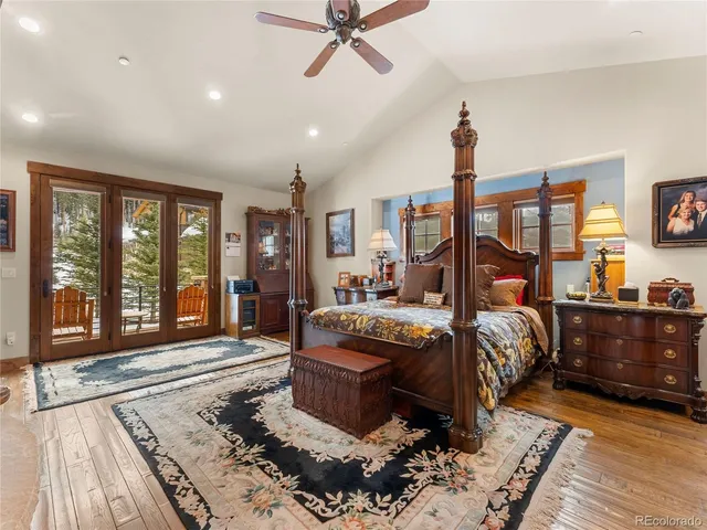 a bed room with a bed and glass window