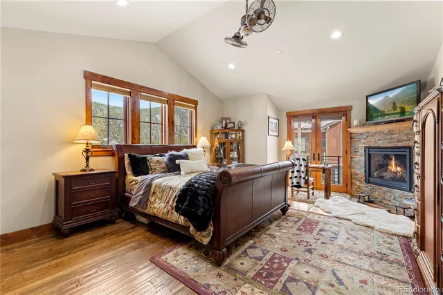 a bed room with a bed and a fireplace