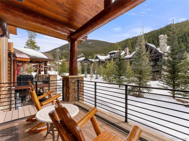 a view of a balcony with wooden floor