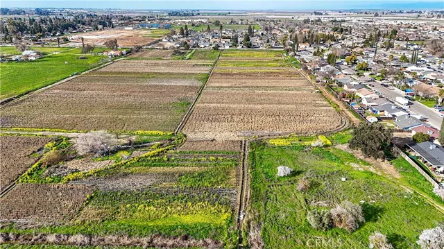 a view of a swimming pool with a table and chairs