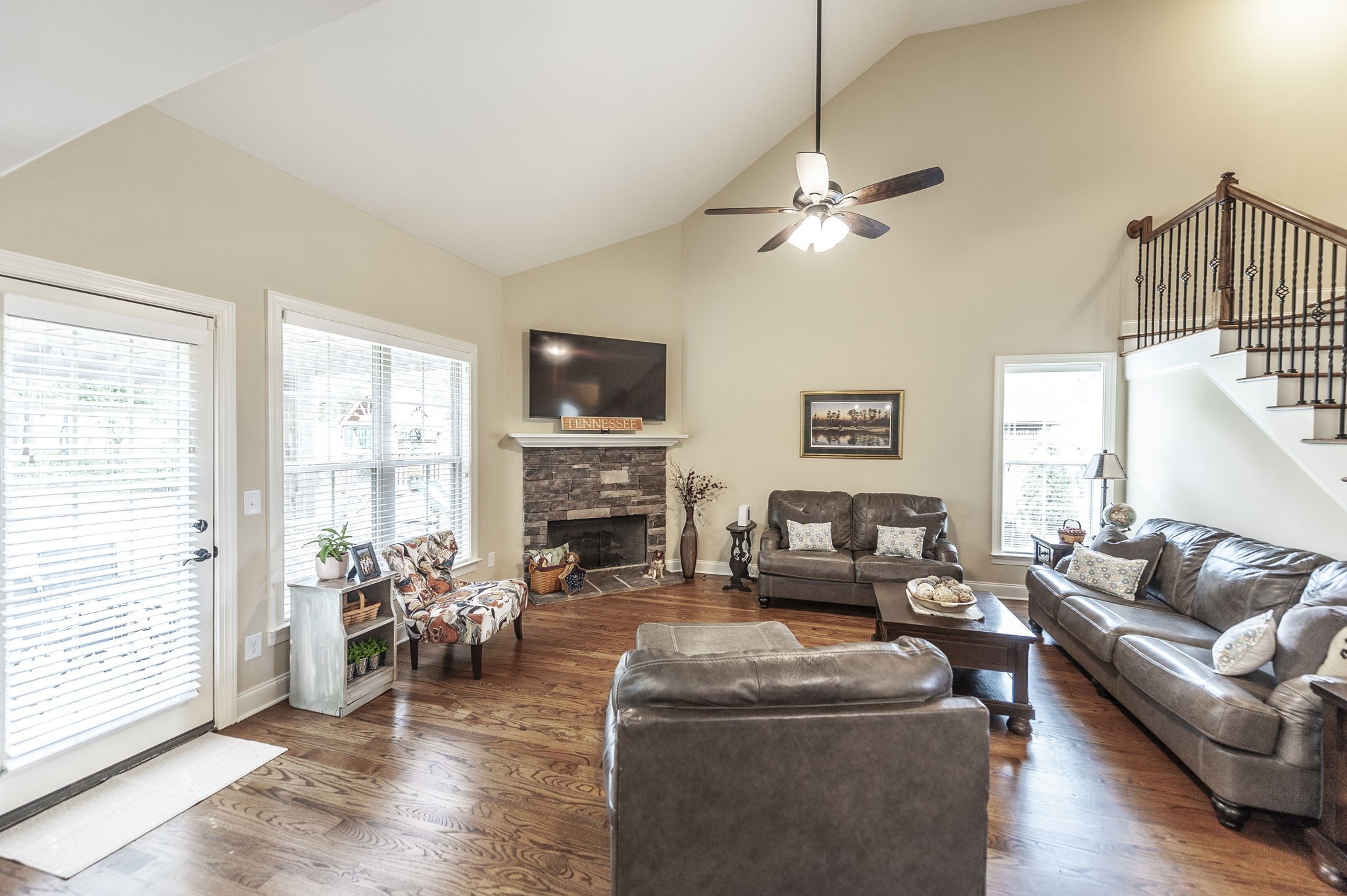 1017 Kendras Run Gallatin, TN 37066 - Photo 11 of 54 a living room with furniture a fireplace and a flat screen tv