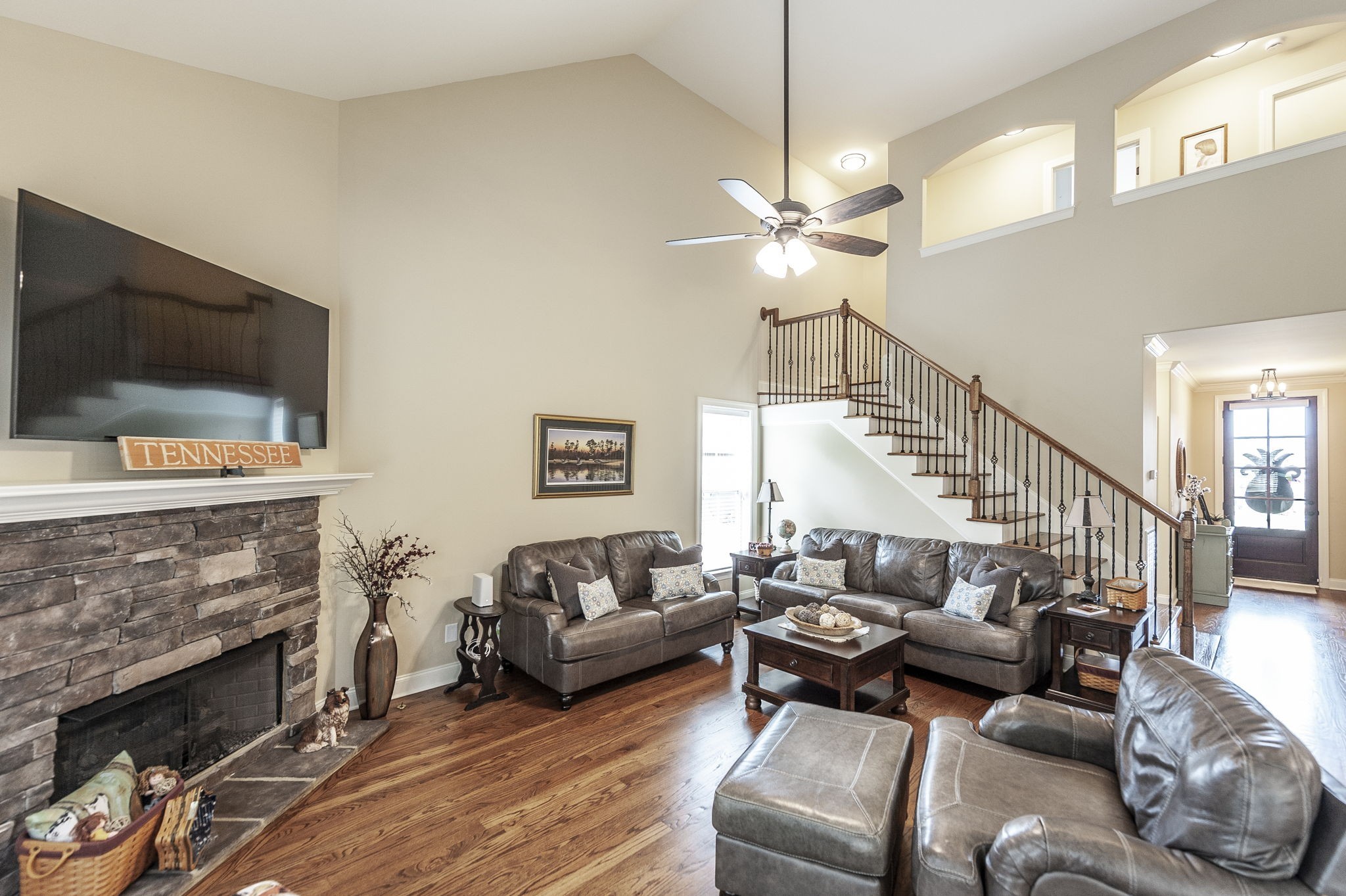 1017 Kendras Run Gallatin, TN 37066 - Photo 12 of 54 a living room with furniture a flat screen tv and a fireplace