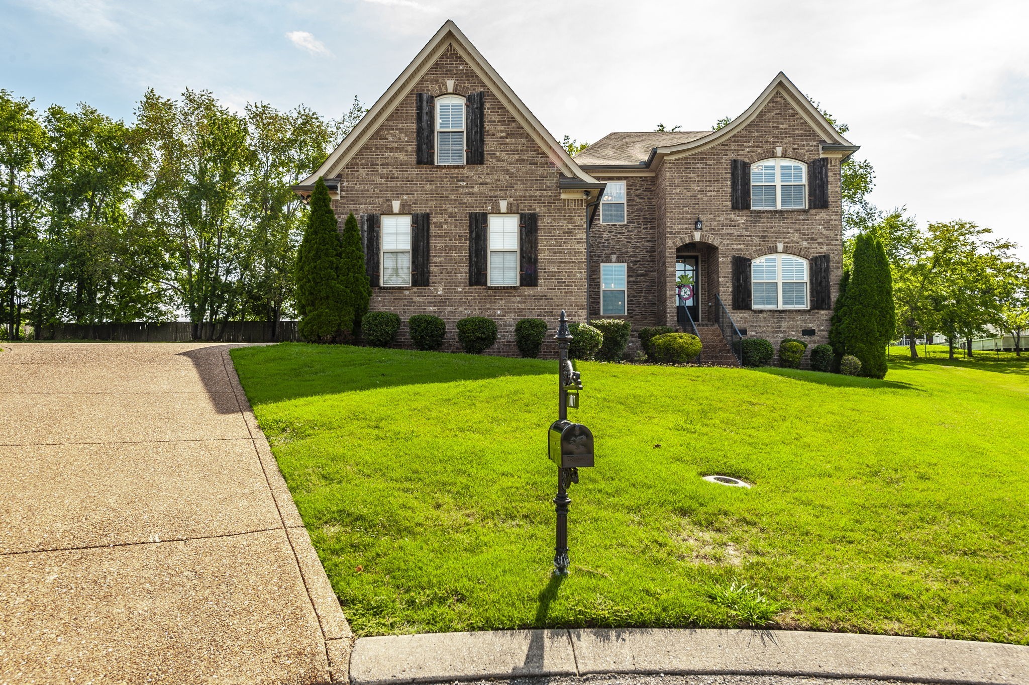 1017 Kendras Run Gallatin, TN 37066 - Photo 3 of 54 a front view of a house with a yard