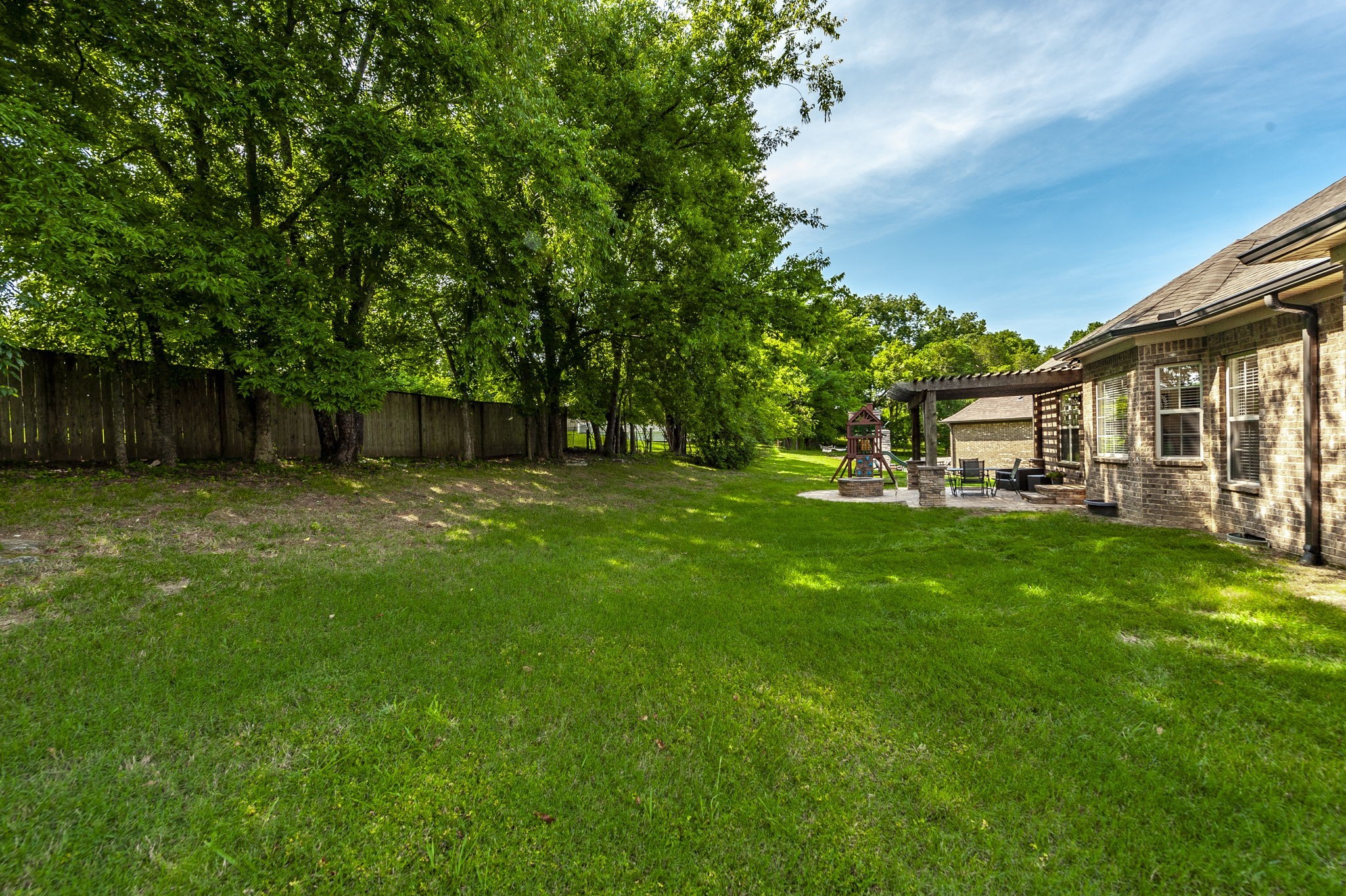 1017 Kendras Run Gallatin, TN 37066 - Photo 50 of 54 a view of a house with backyard and a tree