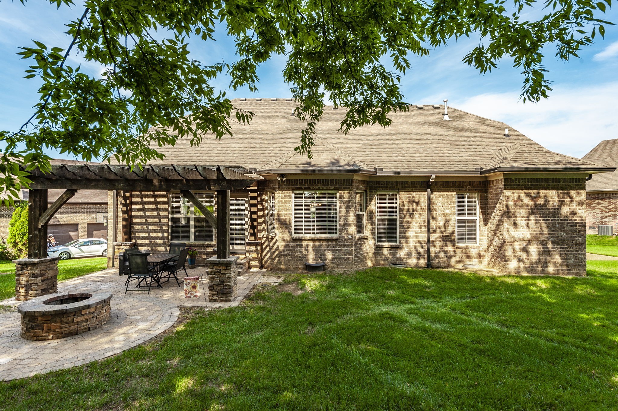1017 Kendras Run Gallatin, TN 37066 - Photo 52 of 54 a view of a house with backyard sitting area and garden