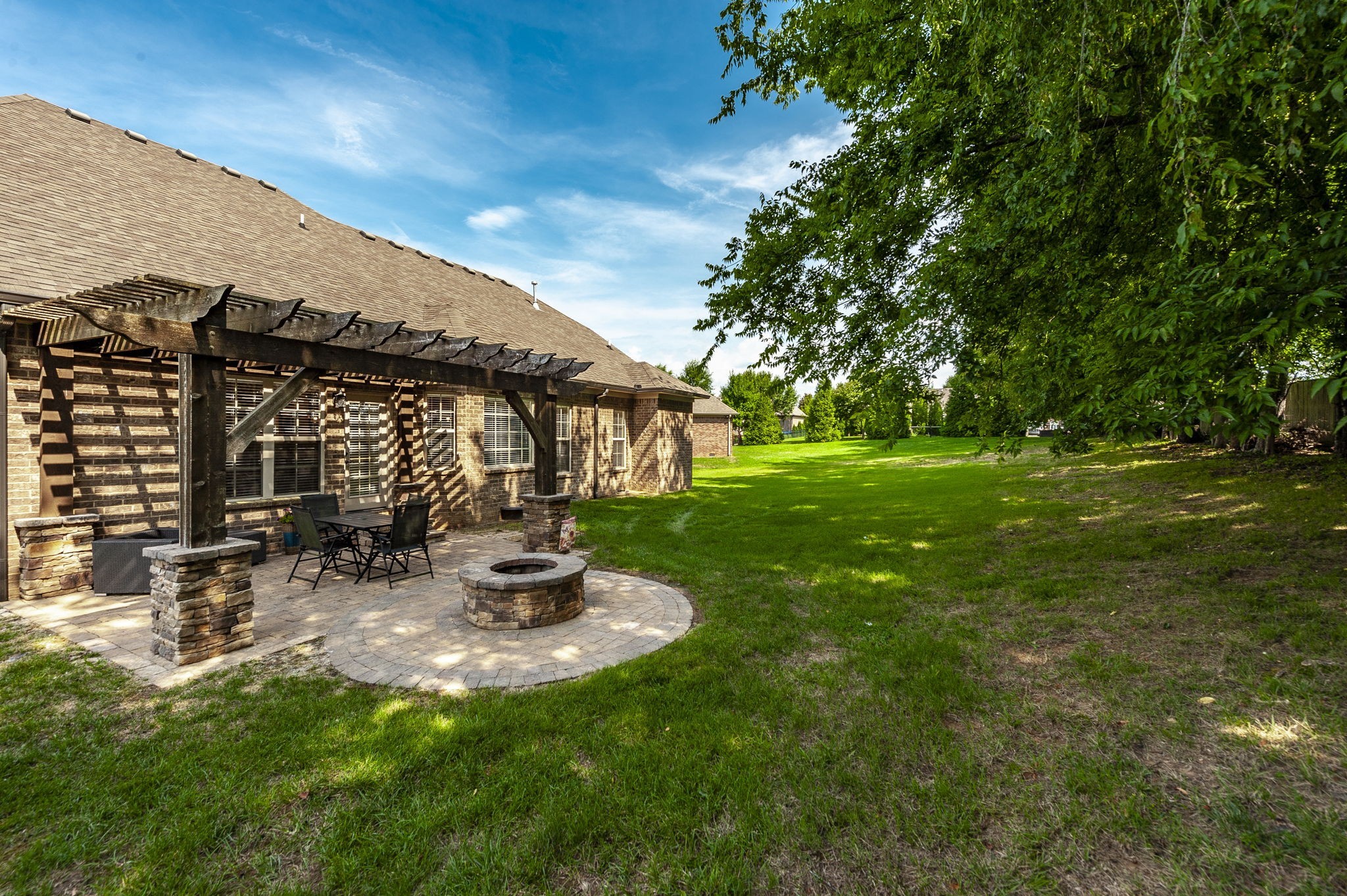 1017 Kendras Run Gallatin, TN 37066 - Photo 54 of 54 a view of a patio with table and chairs under an umbrella