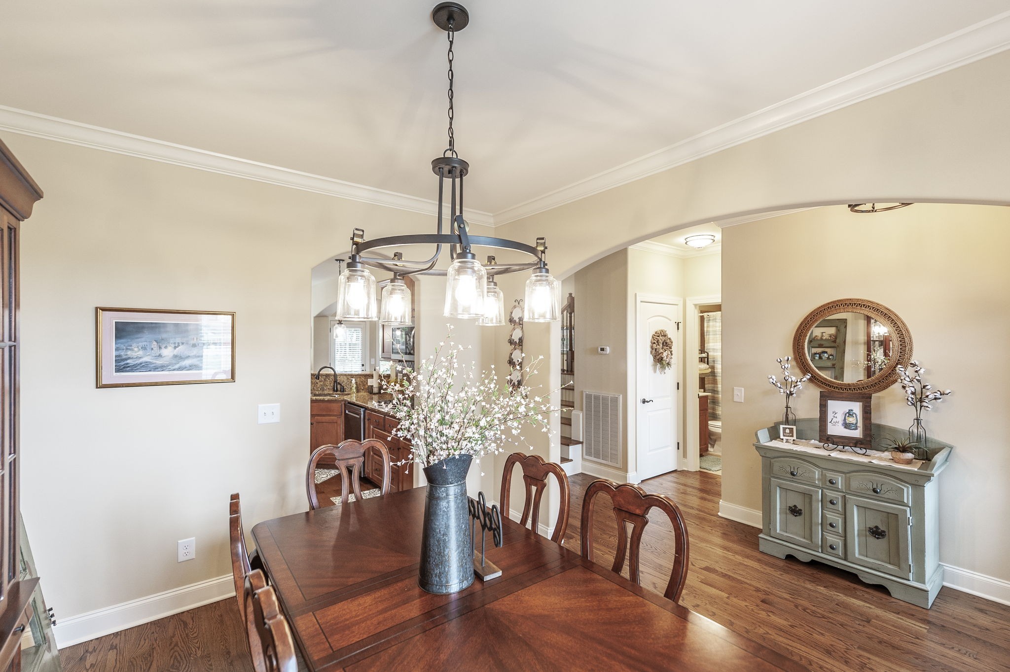 1017 Kendras Run Gallatin, TN 37066 - Photo 9 of 54 a view of a dining room with furniture a chandelier and wooden floor