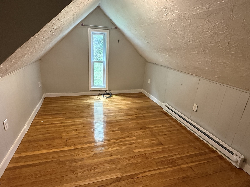 5 Arbor Vitae Street, Unit 2 Worcester, MA 01603 - Photo 11 of 12 a view of empty room with wooden floor