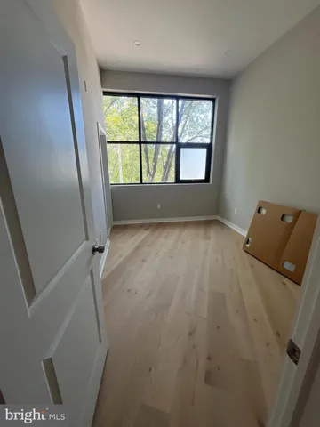 wooden floor and window in an empty room