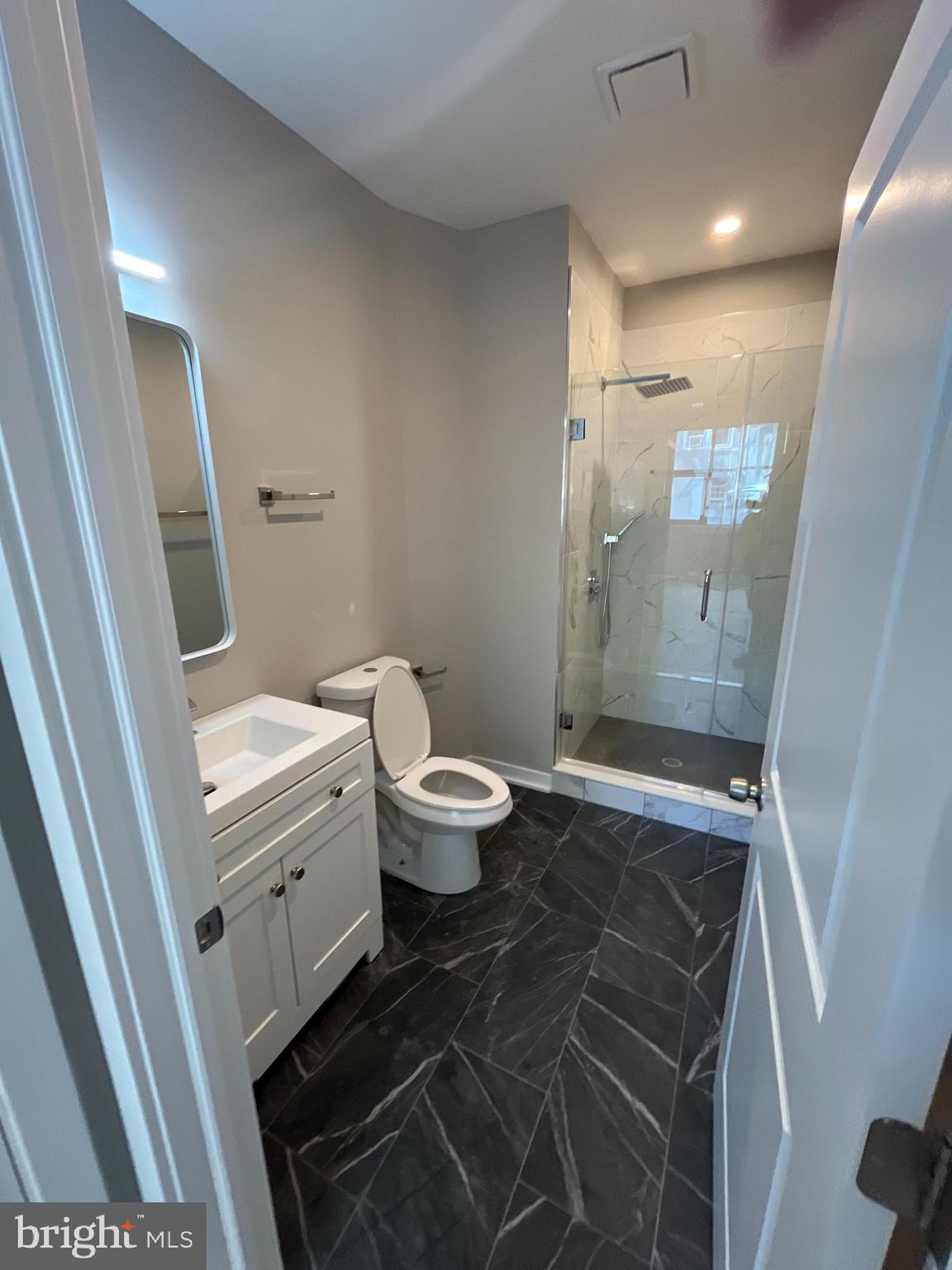 36 North Narberth Avenue, Unit 2B Narberth, PA 19072 - Photo 5 of 5 a bathroom with a toilet and a shower