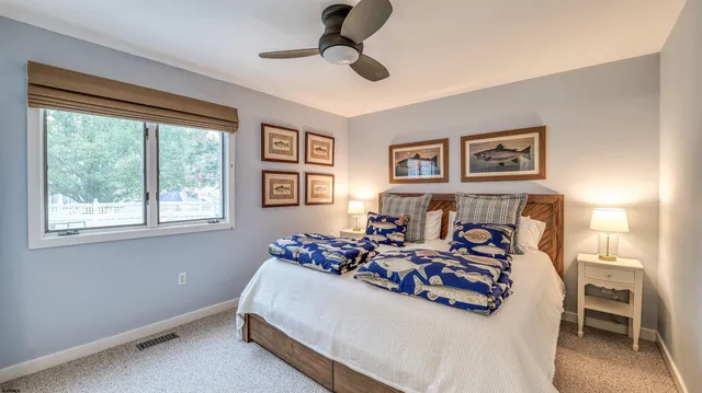 a bedroom with bed and window