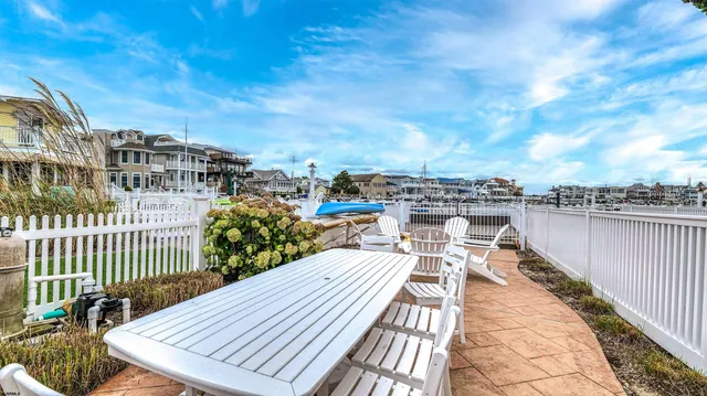 a view of a balcony with wooden floor and city view