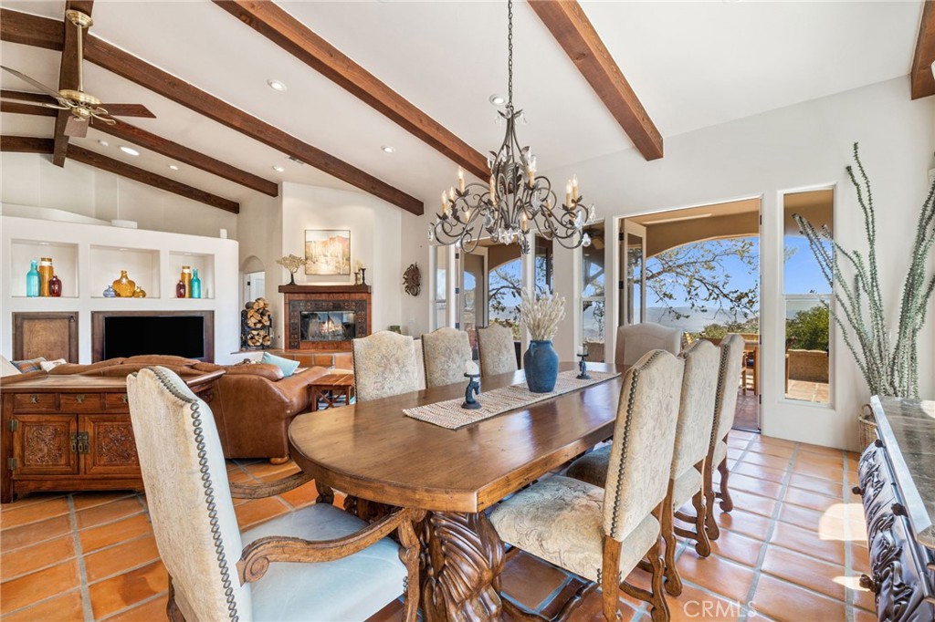 60150 Santa Rosa Road Mountain Center, CA 92561 - Photo 14 of 49 a view of a dining room with furniture wooden floor and chandelier