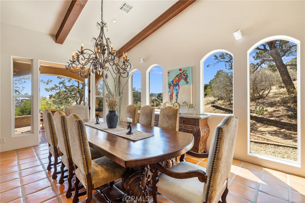60150 Santa Rosa Road Mountain Center, CA 92561 - Photo 16 of 49 a view of a dining room with furniture window and outside view