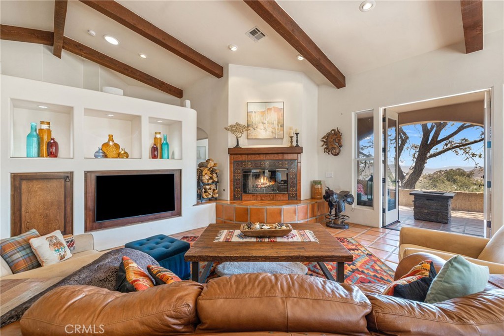 60150 Santa Rosa Road Mountain Center, CA 92561 - Photo 17 of 49 a living room with furniture and a fireplace