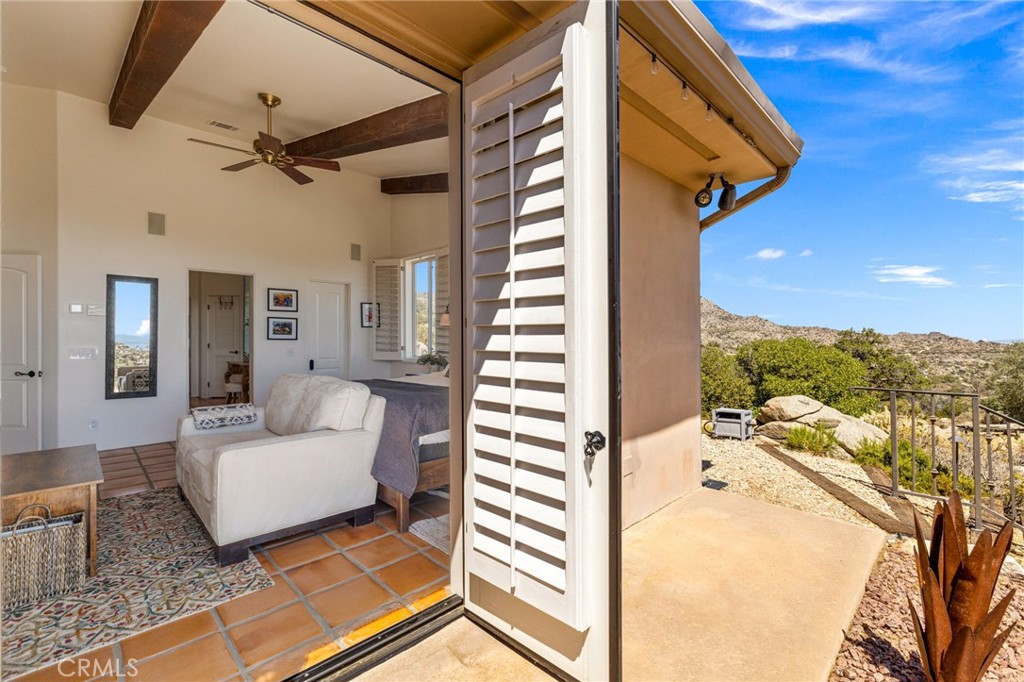 60150 Santa Rosa Road Mountain Center, CA 92561 - Photo 23 of 49 a living room with furniture and a flat screen tv