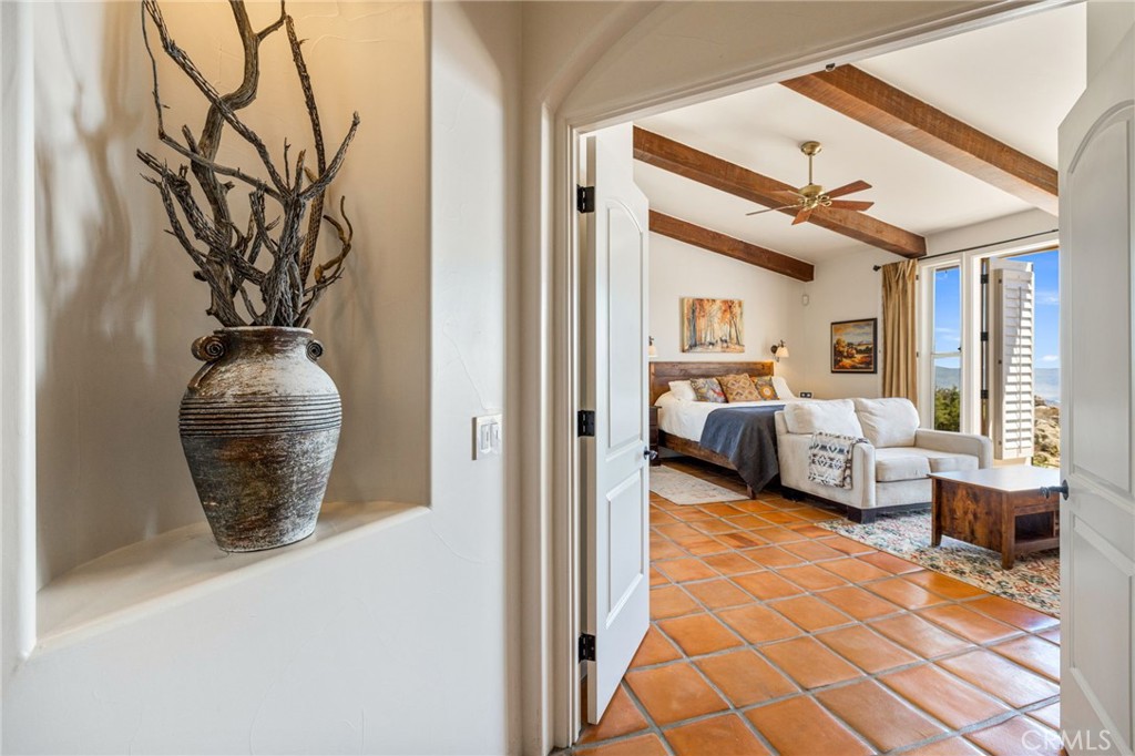 60150 Santa Rosa Road Mountain Center, CA 92561 - Photo 26 of 49 a view of living room filled with furniture and large windows