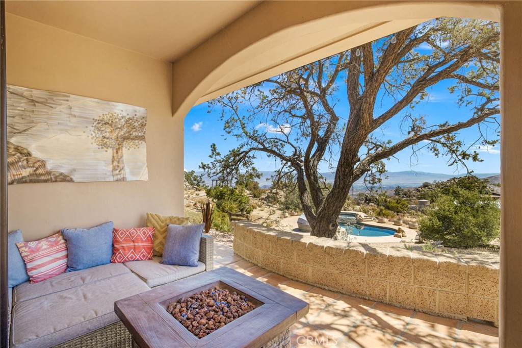 60150 Santa Rosa Road Mountain Center, CA 92561 - Photo 32 of 49 a living room with a couch and a potted plant