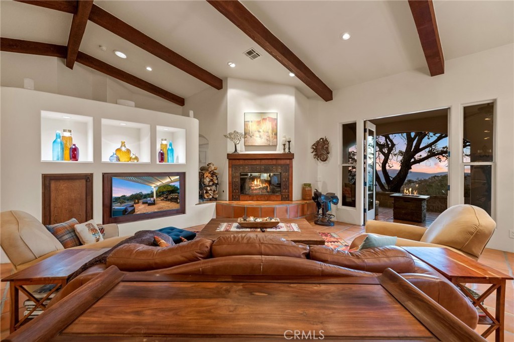 60150 Santa Rosa Road Mountain Center, CA 92561 - Photo 8 of 49 a living room with furniture and a fireplace