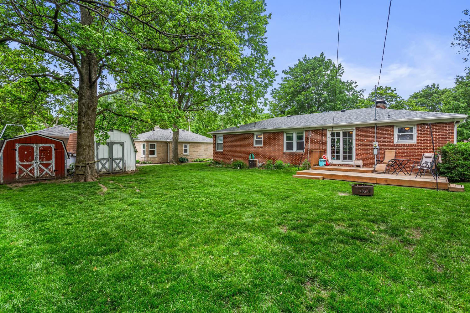 1117 West Union Street Champaign, IL 61821 - Photo 6 of 29 a view of a house with backyard and porch