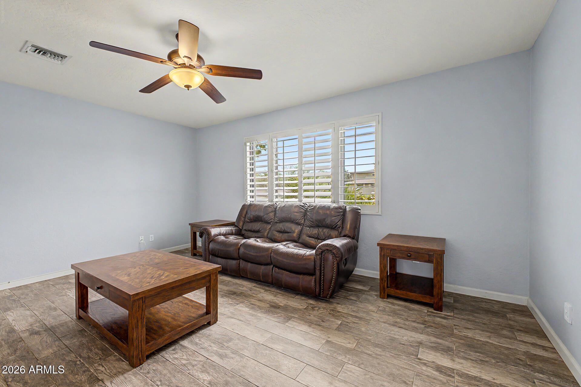 802 East Roberts Road Phoenix, AZ 85022 - Photo 2 of 24 a living room with furniture and a window
