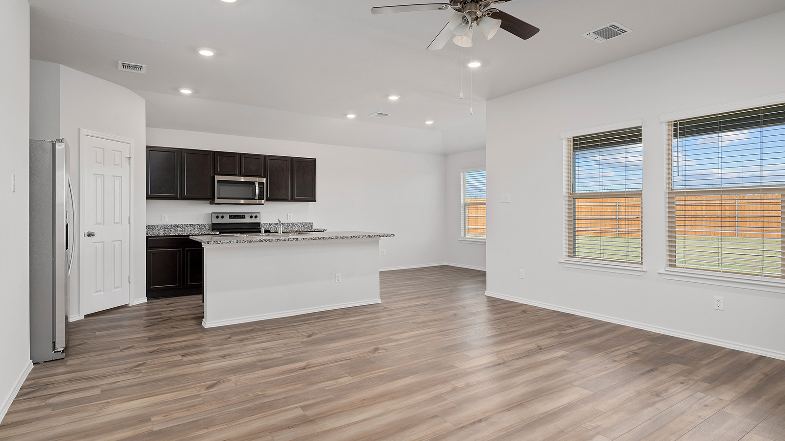 1312 Victory Rnch Trail Killeen, TX 76549 - Photo 22 of 22 Kitchen featuring stainless steel appliances, a ceiling fan, a kitchen island, open floor plan, and recessed lighting
